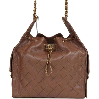 Brown quilted caviar hobo bag with chain strap and Chanel turn-lock clasp