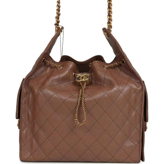 Brown quilted caviar hobo bag with chain strap and Chanel turn-lock clasp