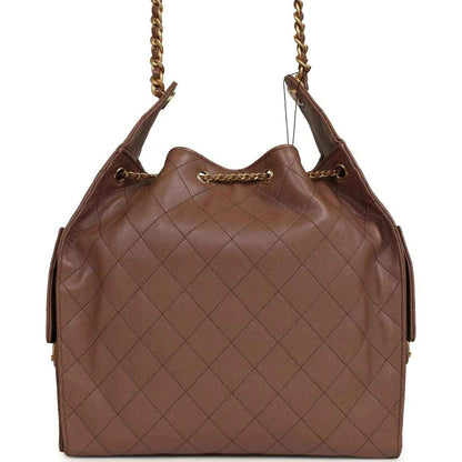 Brown quilted caviar hobo bag with gold-tone chain handles and Chanel clasp