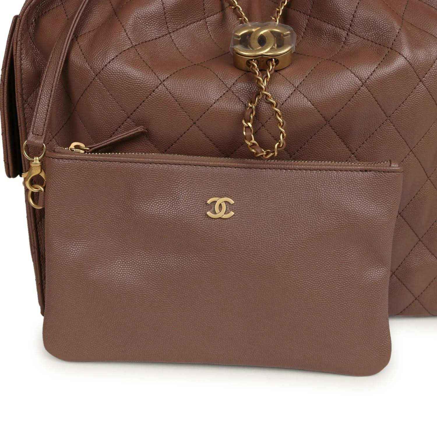 Brown inner zip pouch with Chanel logo and gold-tone chain detail
