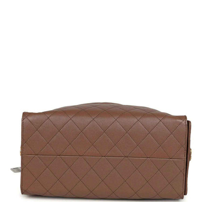 Brown quilted hobo bag back panel with diamond stitching