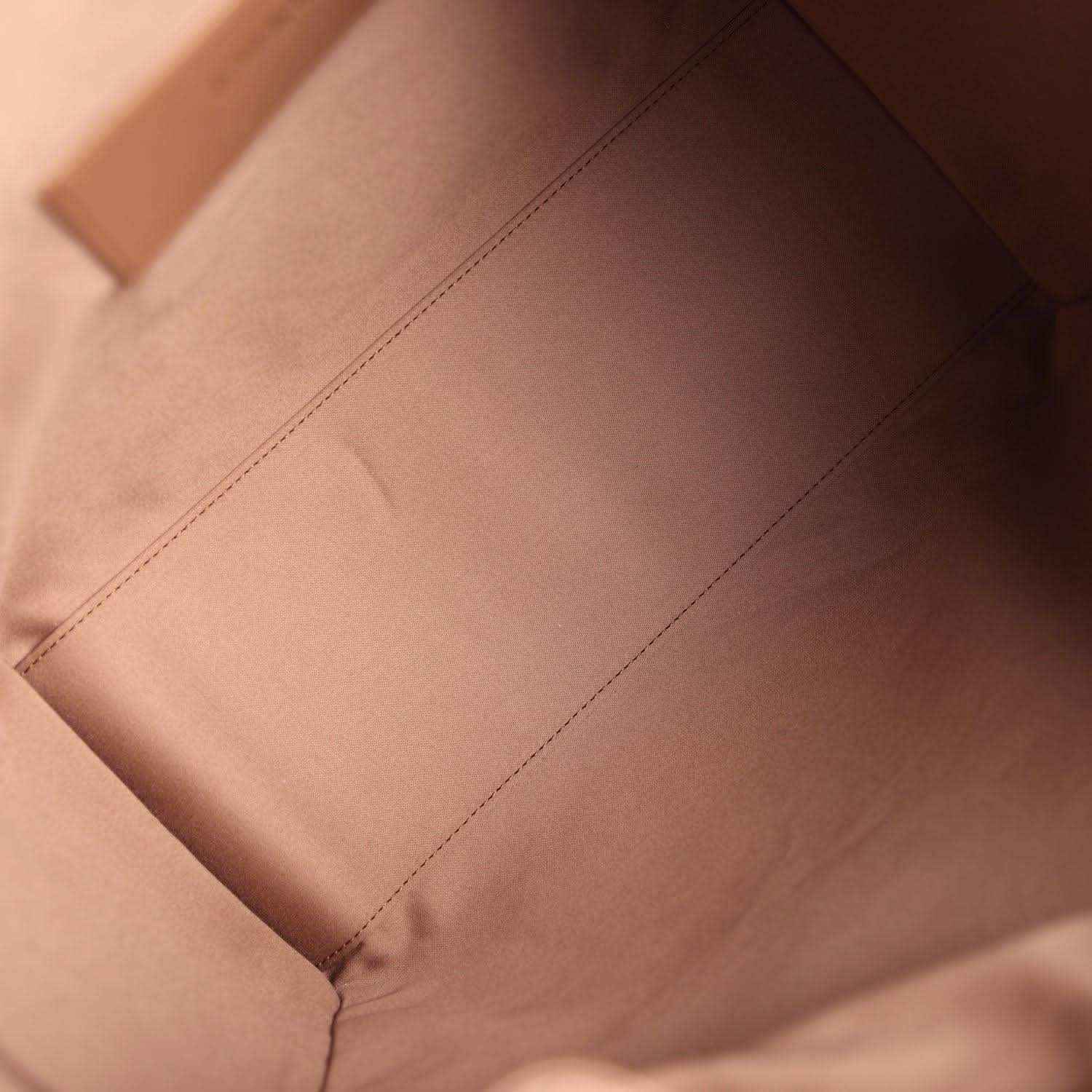 Brown leather interior lining with stitched seams