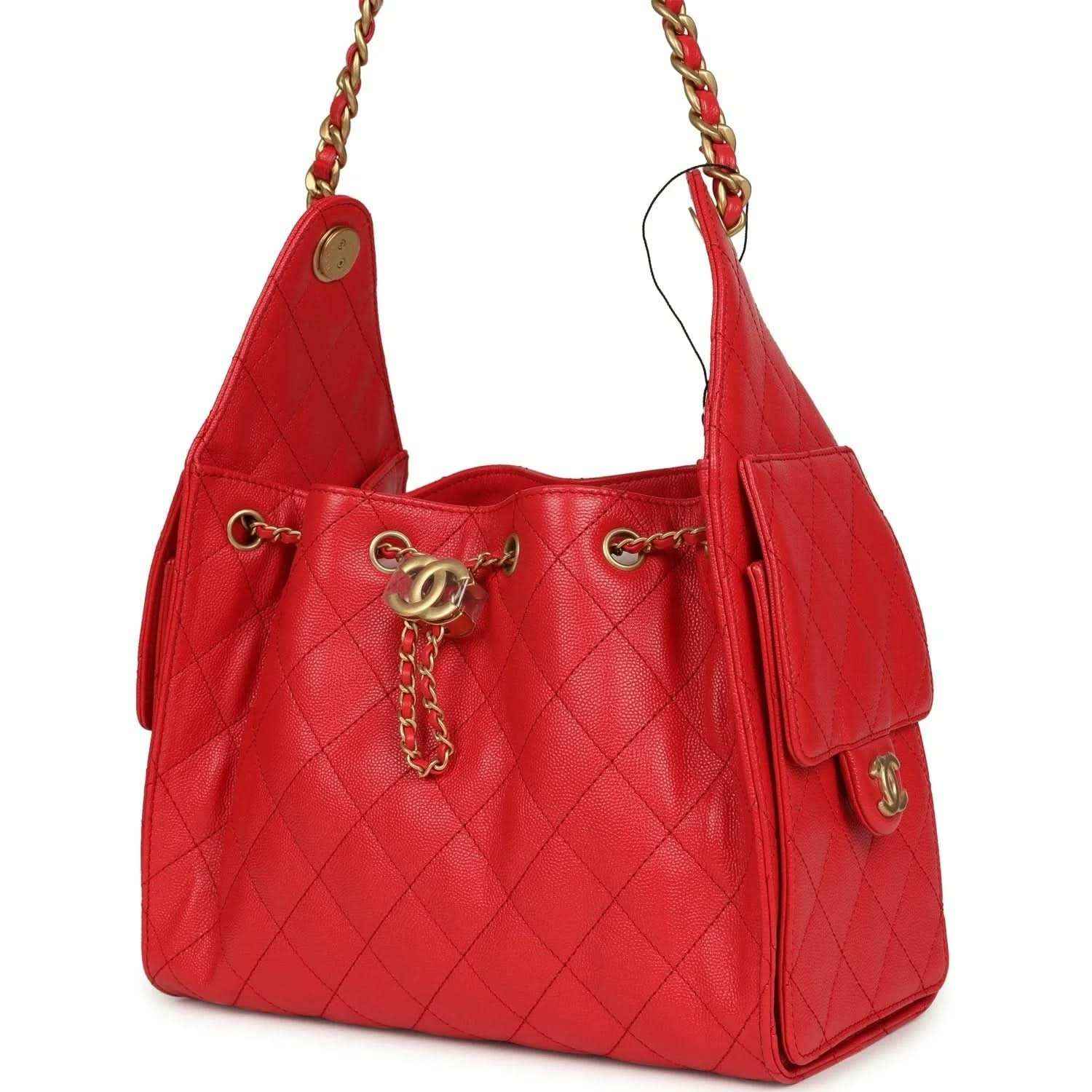 Chanel Small 25 hobo bag, dark red quilted caviar leather, side profile with strap tab