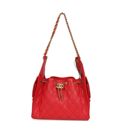 Chanel Small 25 hobo bag, dark red quilted caviar leather, angled view with chain straps