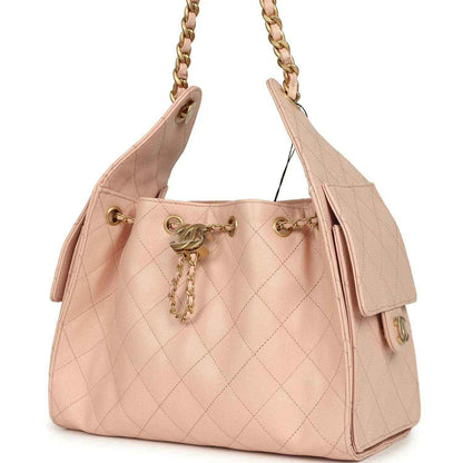 Chanel small hobo bag, light pink quilted caviar leather, gold top hardware and charm