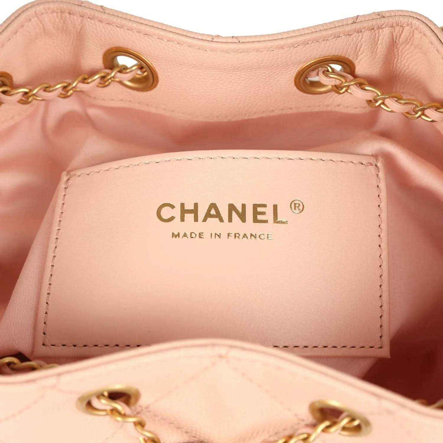 Chanel interior label reading CHANEL and MADE IN FRANCE on light pink lining
