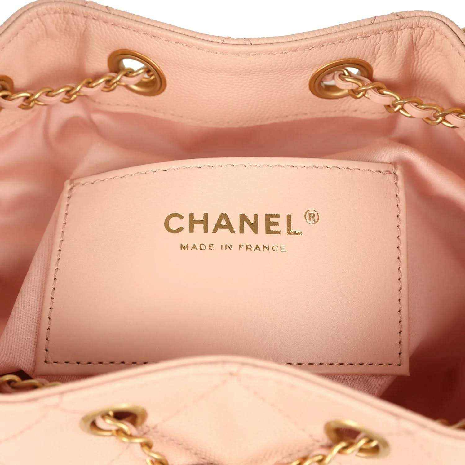 Chanel interior label reading CHANEL and MADE IN FRANCE on light pink lining