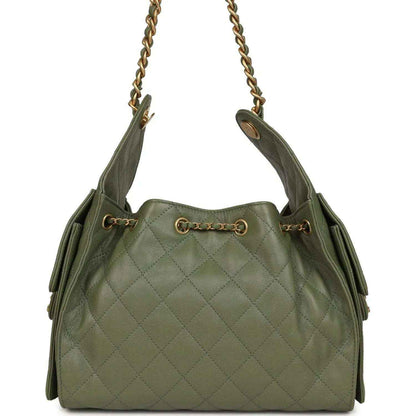 Olive green quilted hobo bag with top chain handles and drawstring pull, gold hardware