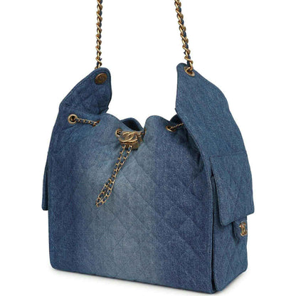 Chanel Medium 25 hobo bag, blue washed denim with top clasp and chain pull tab