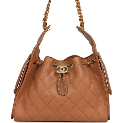 Brown quilted leather hobo bag with gold chain handles and top drawstring