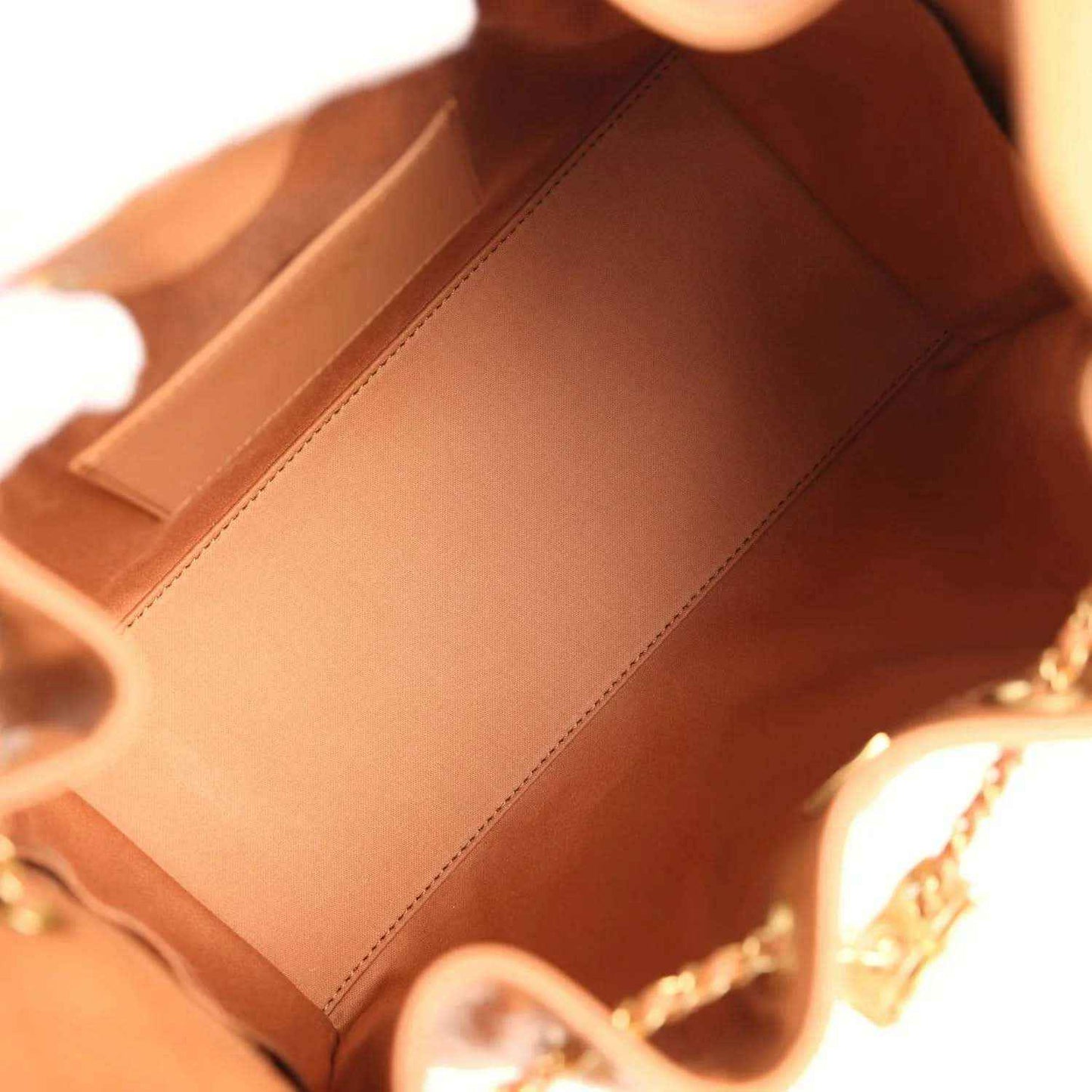 Brown leather interior with stitched lining and chain strap attachment