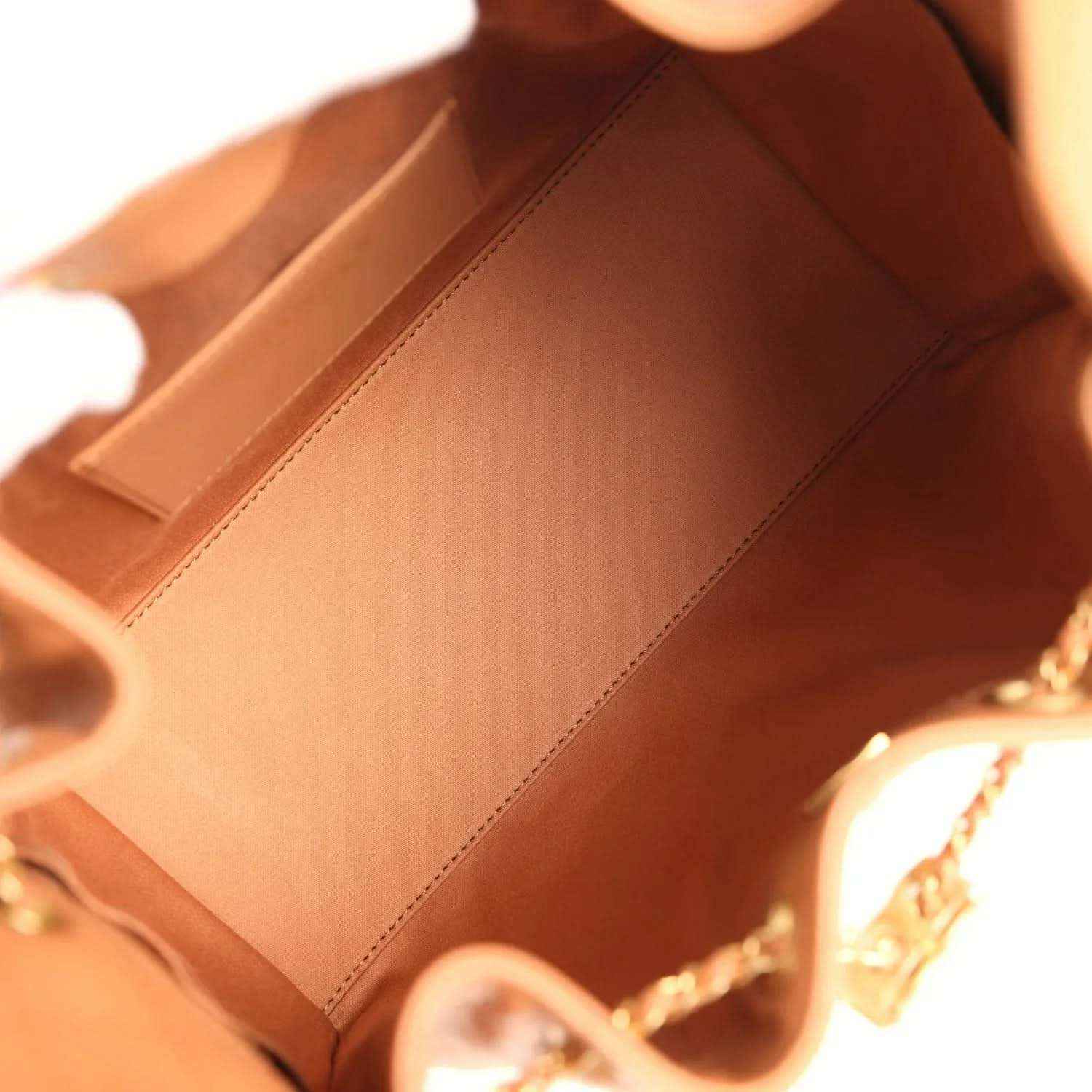 Brown leather interior with stitched lining and chain strap attachment
