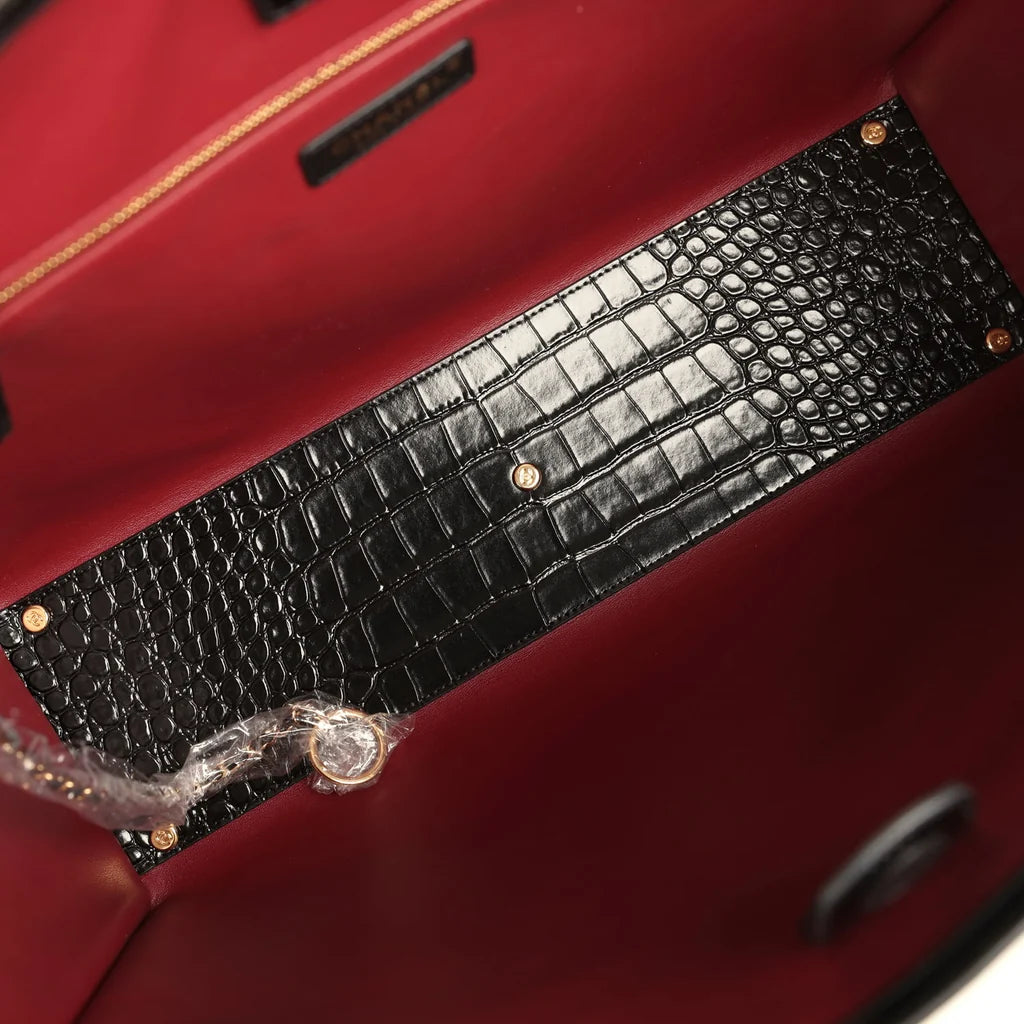 Small Chanel shopping bag strap and crocodile-embossed panel in dark red