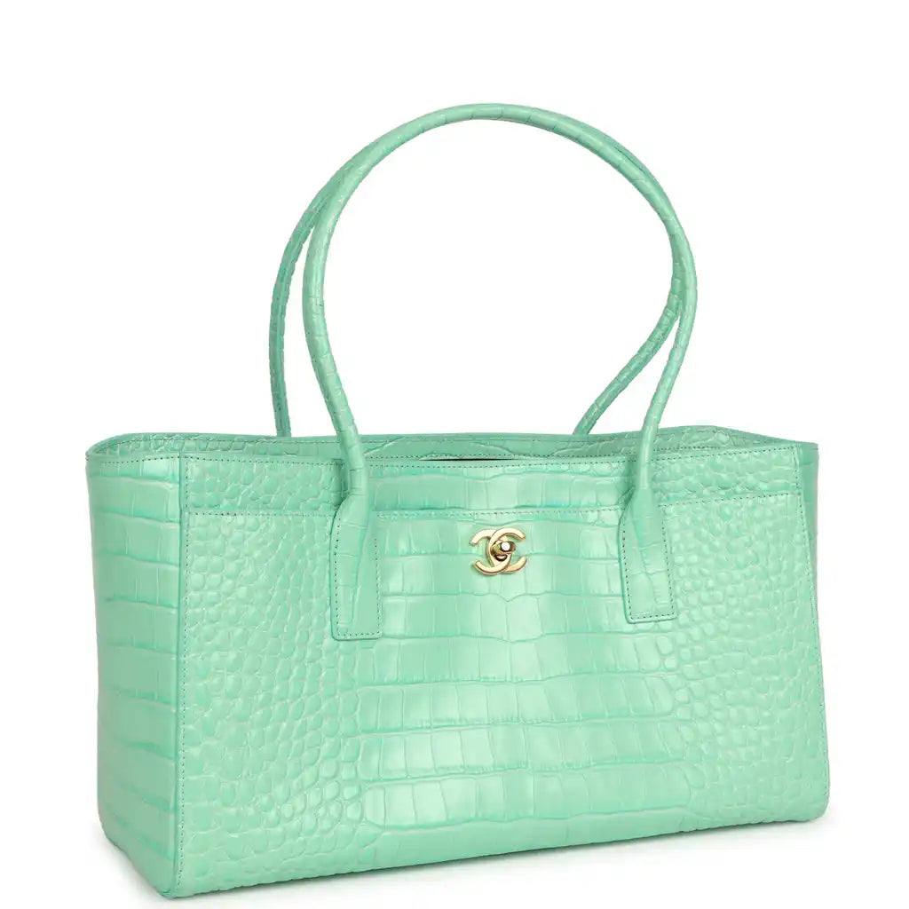 Teal croc-embossed leather shopping tote with front pocket and gold Chanel logo