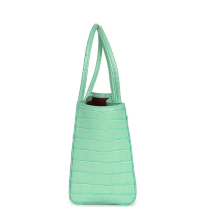 Teal croc-embossed leather tote bag with top handles and open top