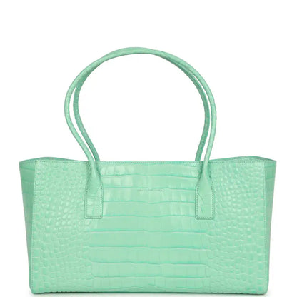 Teal croc-embossed leather tote with wide handles and front center pocket