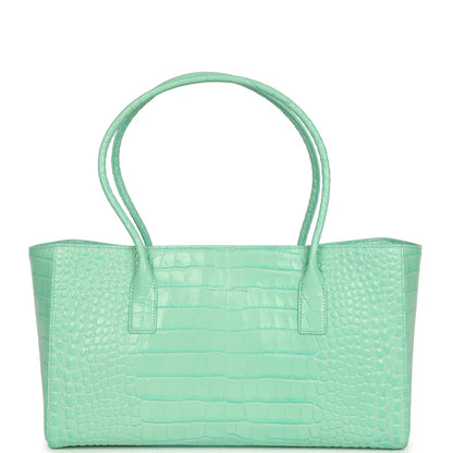 Teal croc-embossed leather tote with wide handles and front center pocket