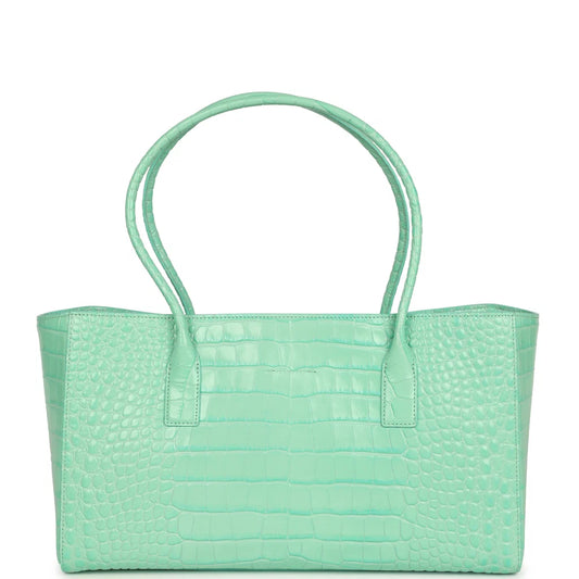 Teal croc-embossed leather tote with wide handles and front center pocket