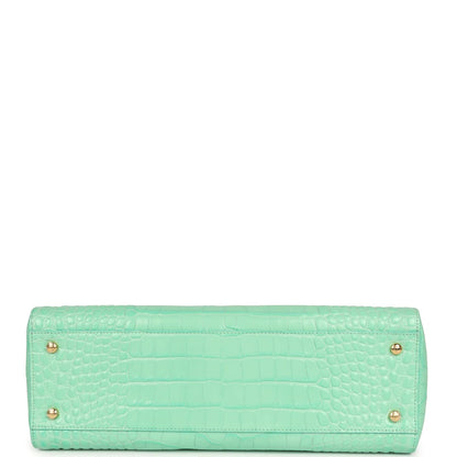 Teal croc-embossed leather rectangular bag with two rear feet grommets