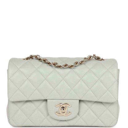 Light grey quilted mini flap bag with gold-tone chain and logo clasp
