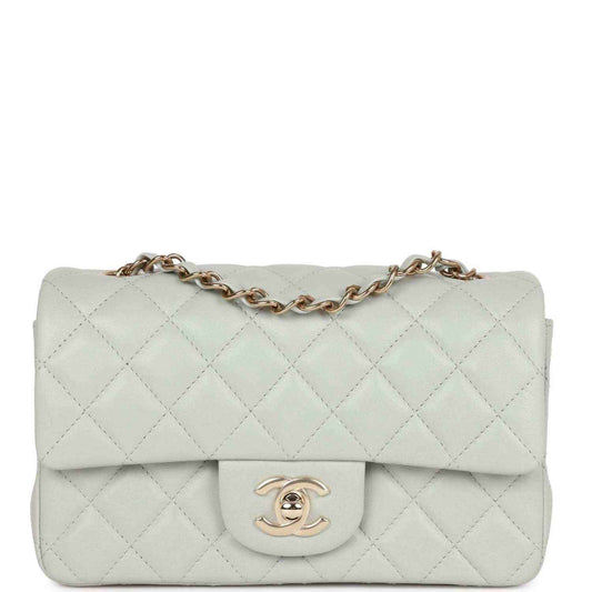 Light grey quilted mini flap bag with gold-tone chain and logo clasp