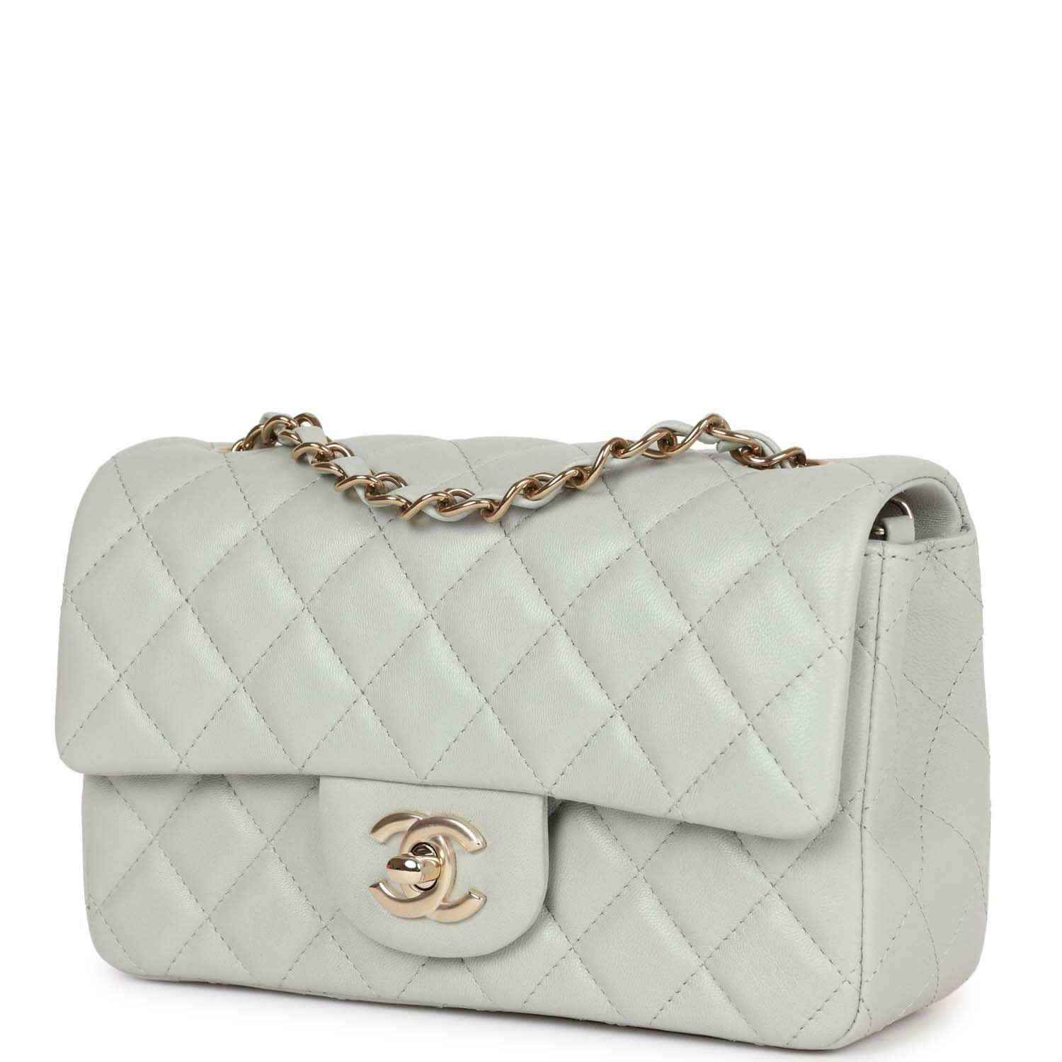 Light grey quilted mini flap bag 3/4 view with logo clasp and gold-tone chain