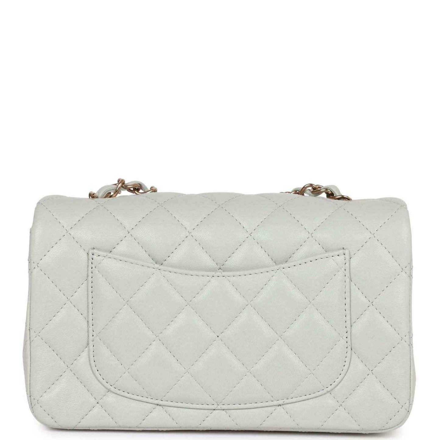 Light grey quilted mini flap bag back view with stitched pocket panel