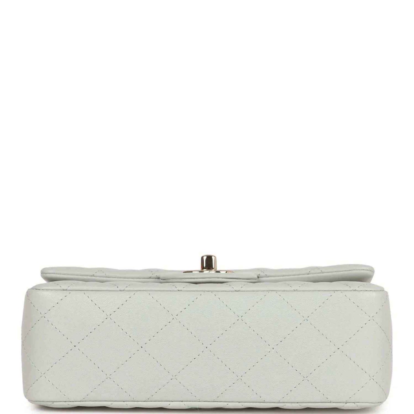 Light grey quilted mini flap bag bottom view with small gold-tone post clasp