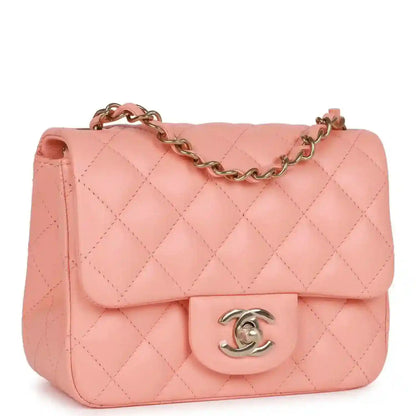 Pink quilted lambskin mini flap bag with gold chain and Chanel turn-lock clasp