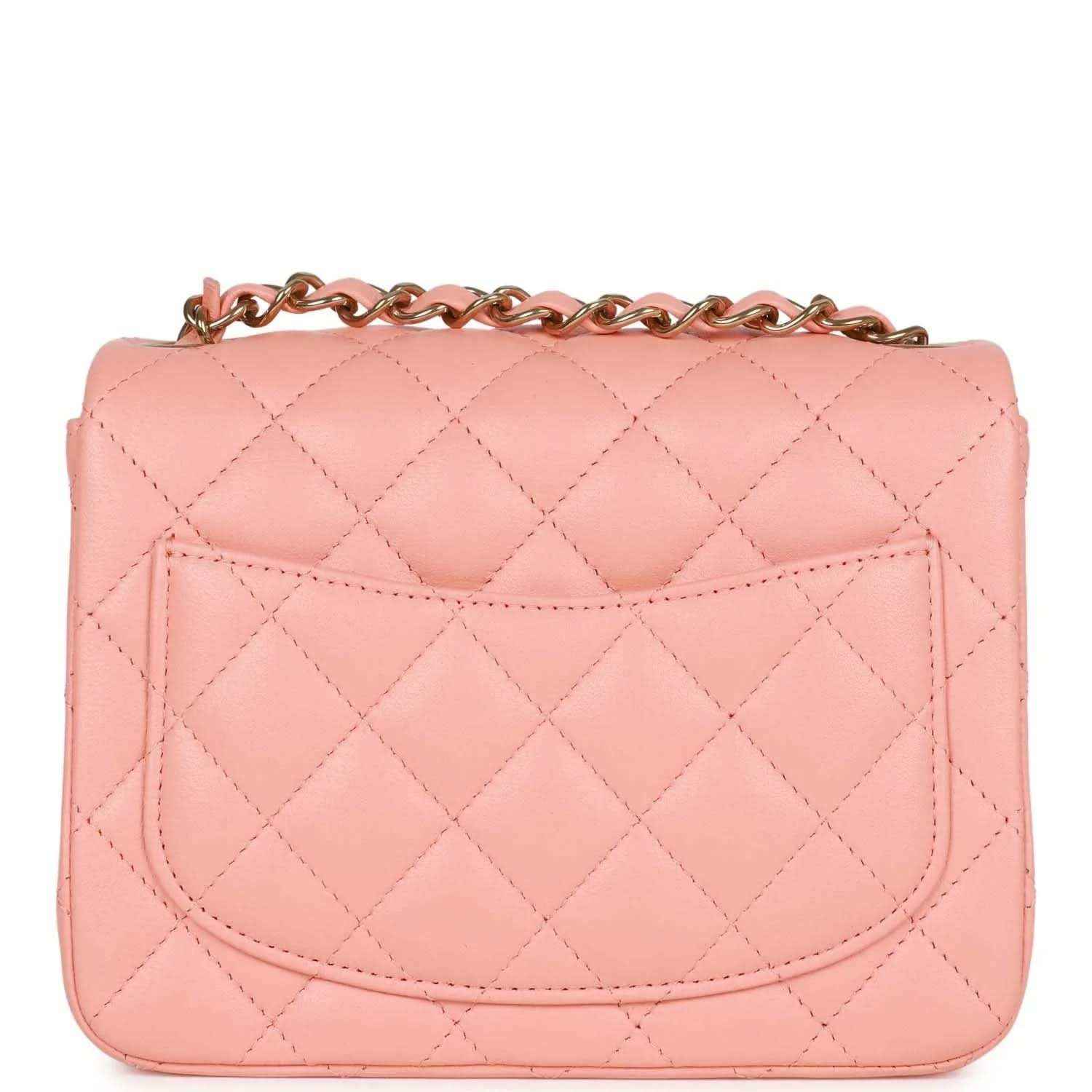 Pink quilted mini flap bag with front flap panel and gold Chanel turn-lock clasp