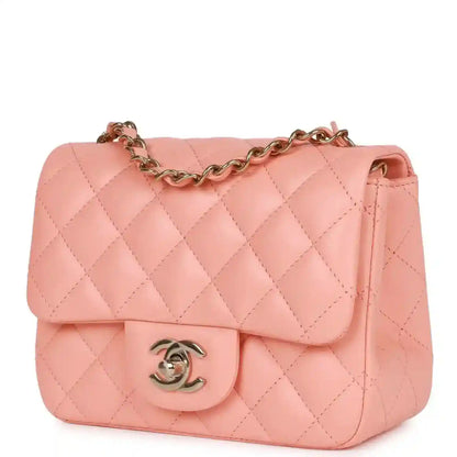 Pink quilted mini flap bag with gold chain strap and Chanel logo clasp on front