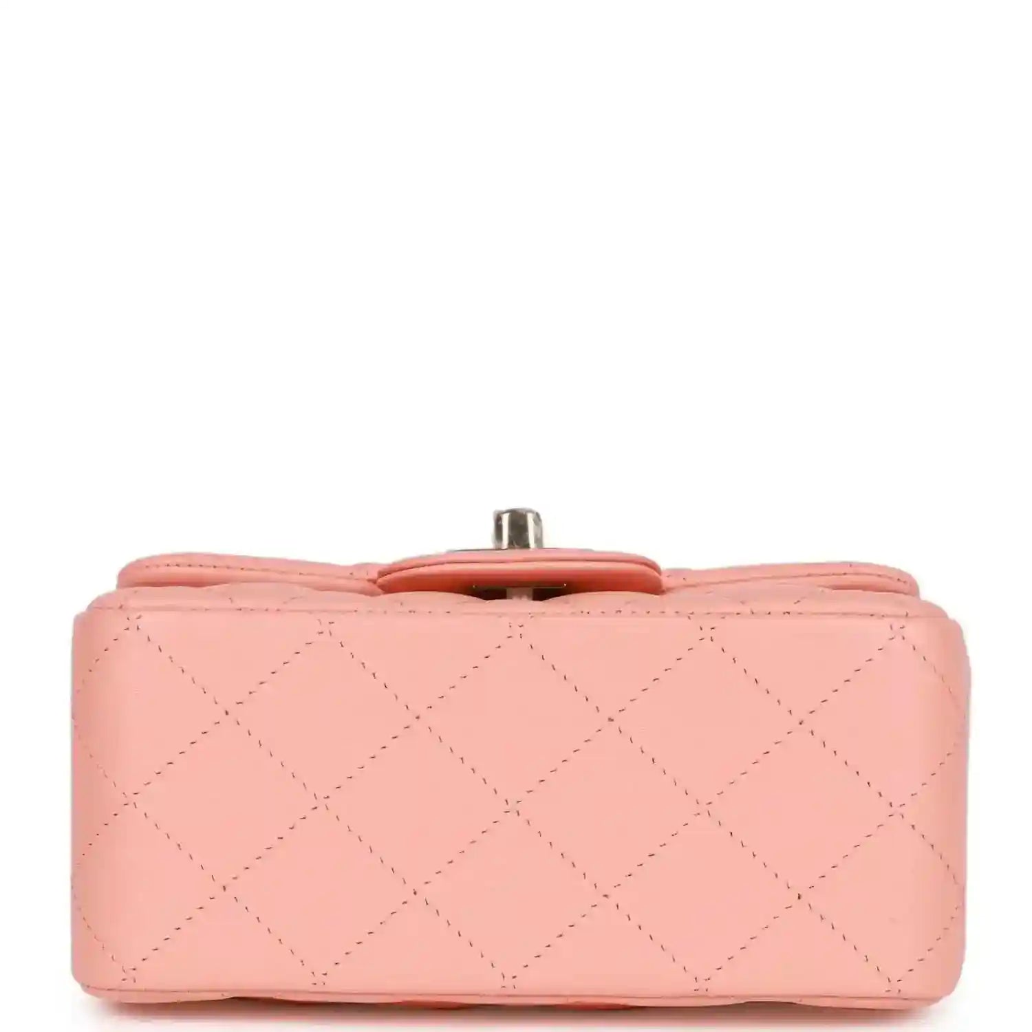 Pink quilted mini flap bag top view with small gold hardware tab