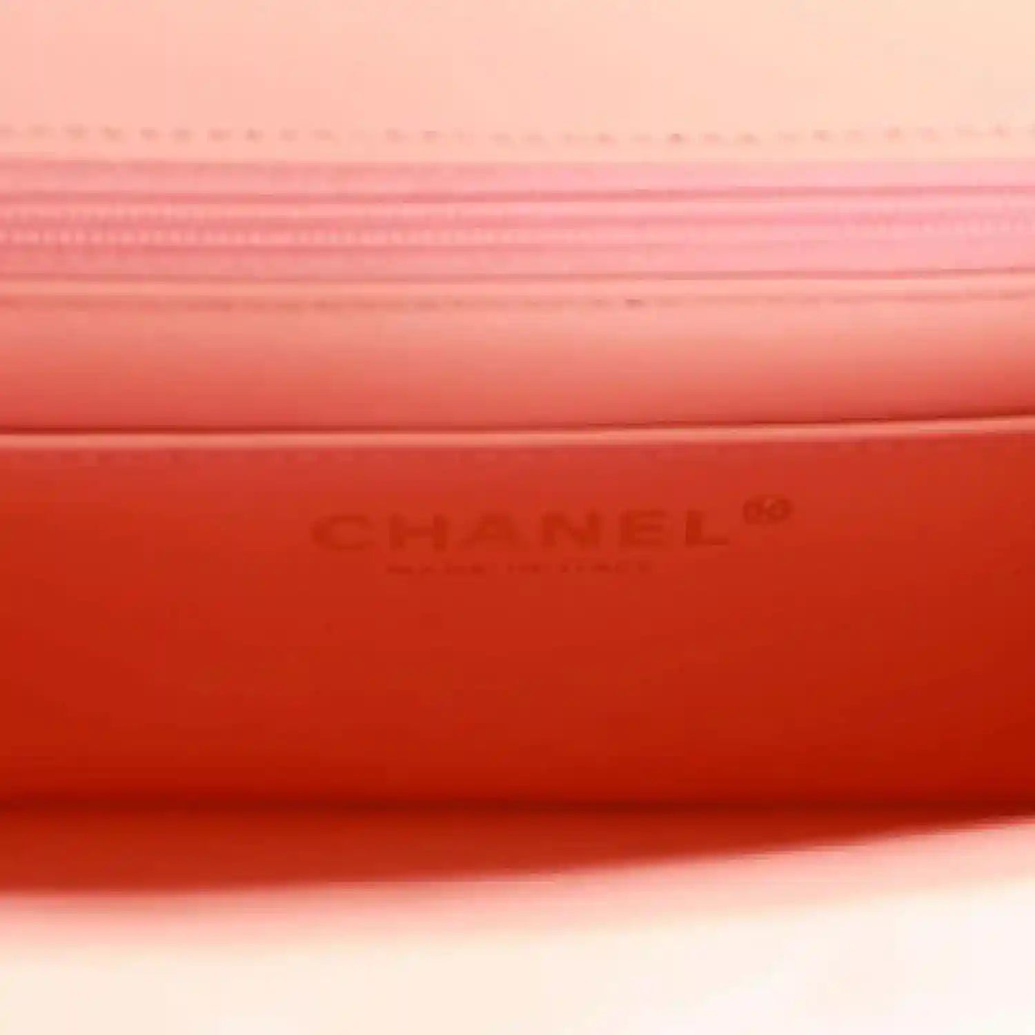 Mini flap bag interior lining with embossed “CHANEL” text
