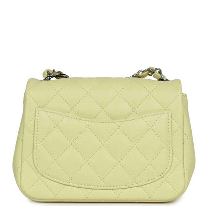 Lime quilted mini square flap bag, back view with stitched flap and curved seams