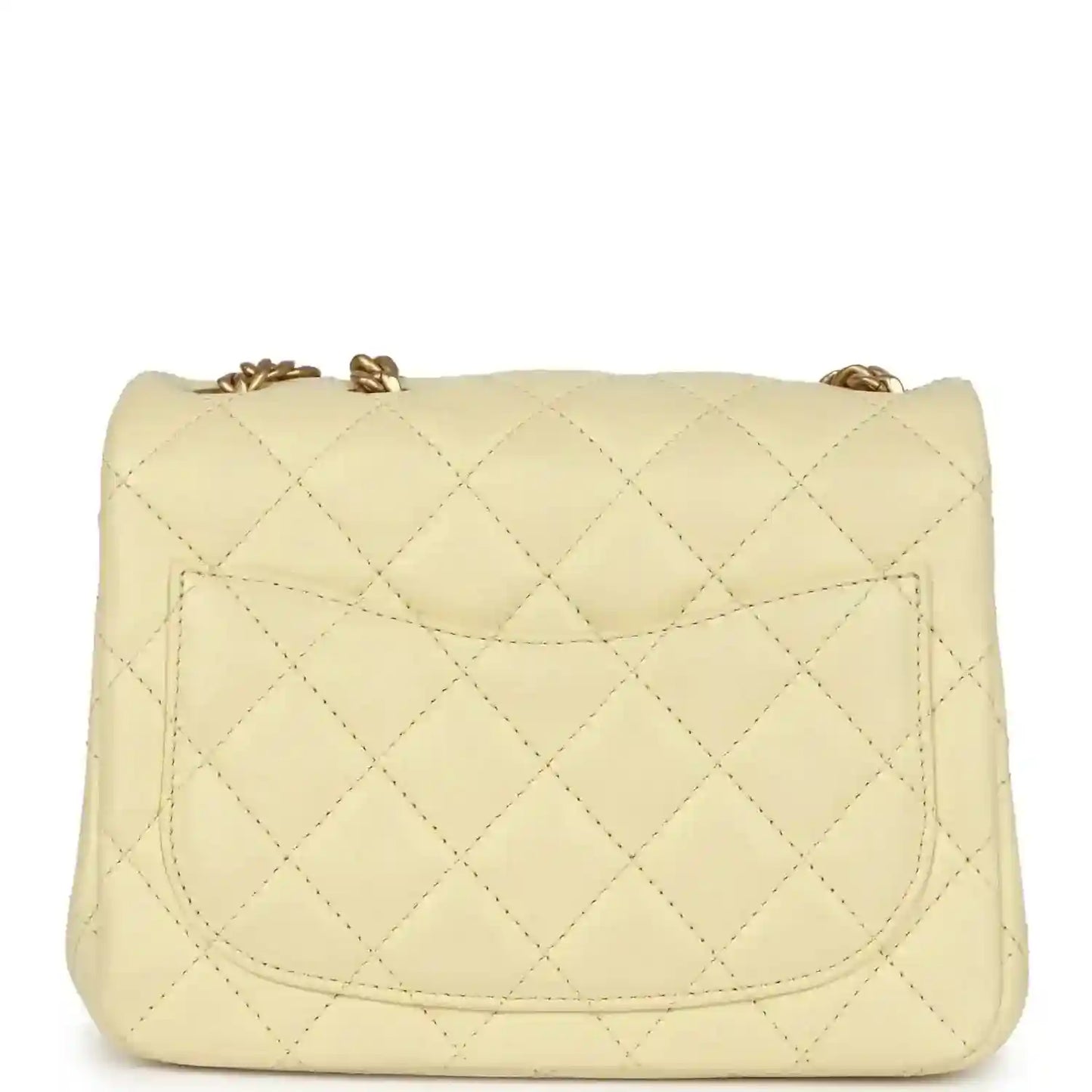 Mini quilted flap bag in pale yellow leather with stitched pocket flap detail and gold top closure