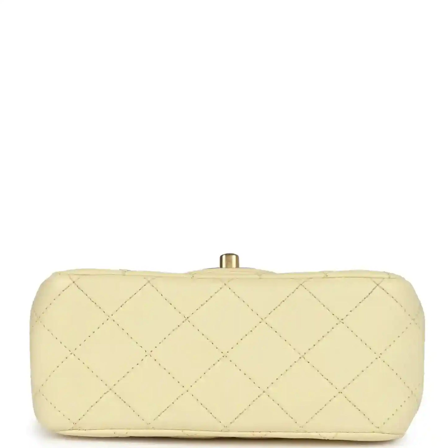 Mini quilted flap bag in pale yellow leather, back view with gold top clasp