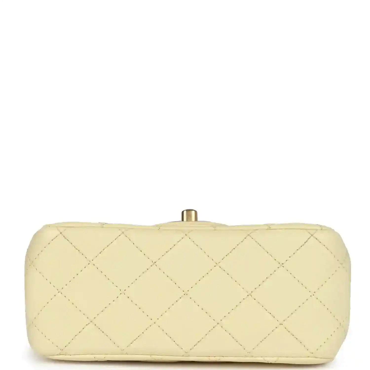 Mini quilted flap bag in pale yellow leather, back view with gold top clasp