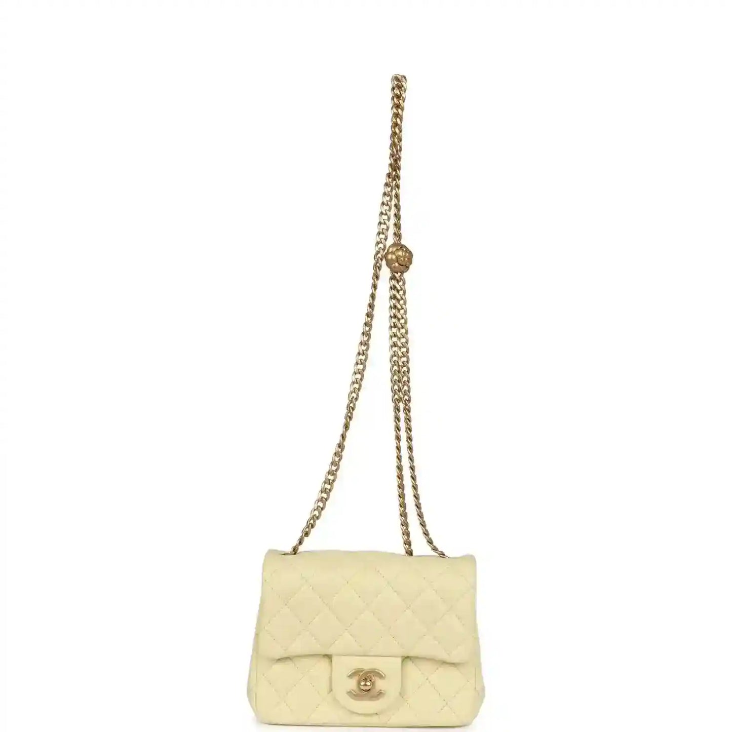 Mini quilted flap bag in pale yellow leather on gold chain shoulder strap