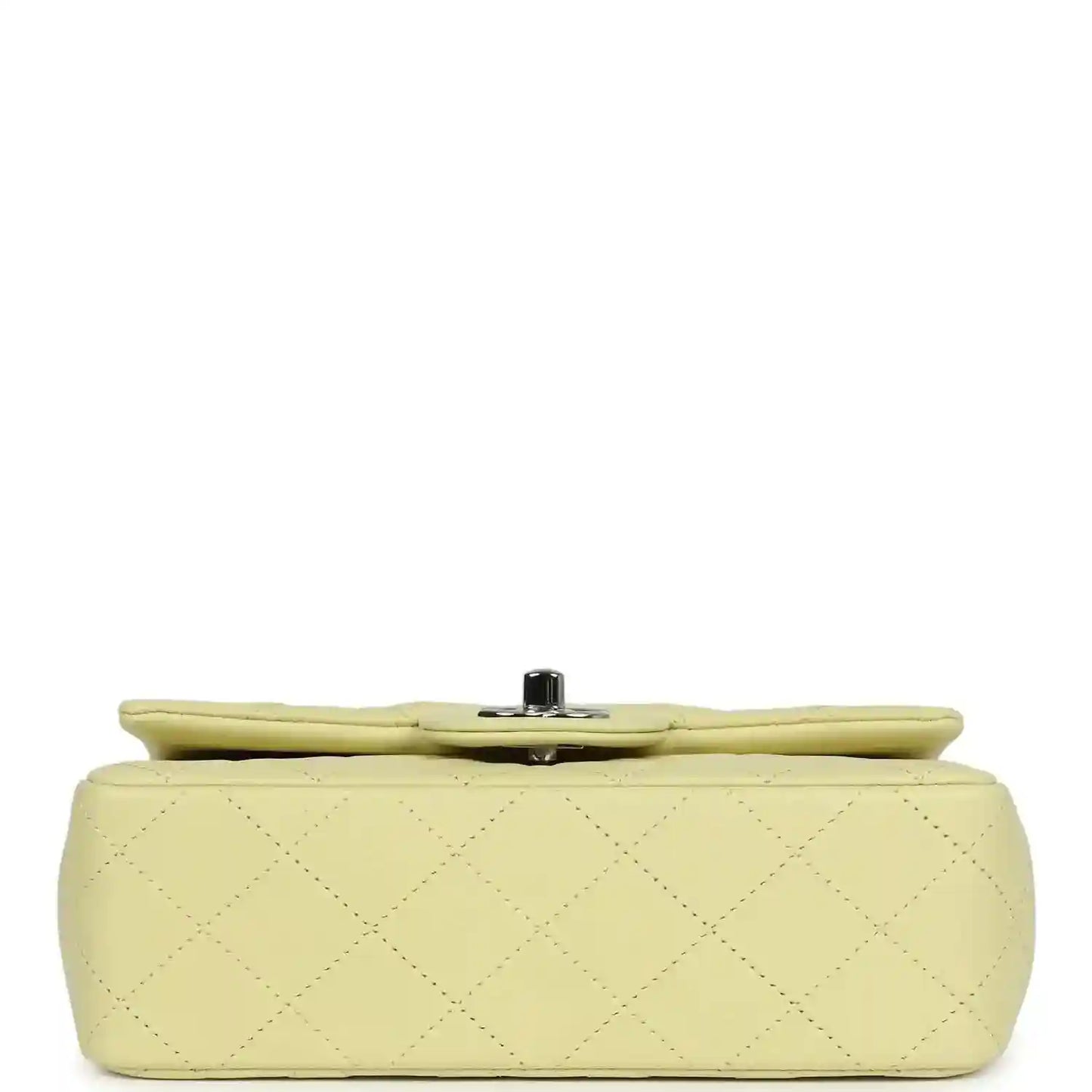 Lime mini flap bag underside with quilted lambskin and small metal feet
