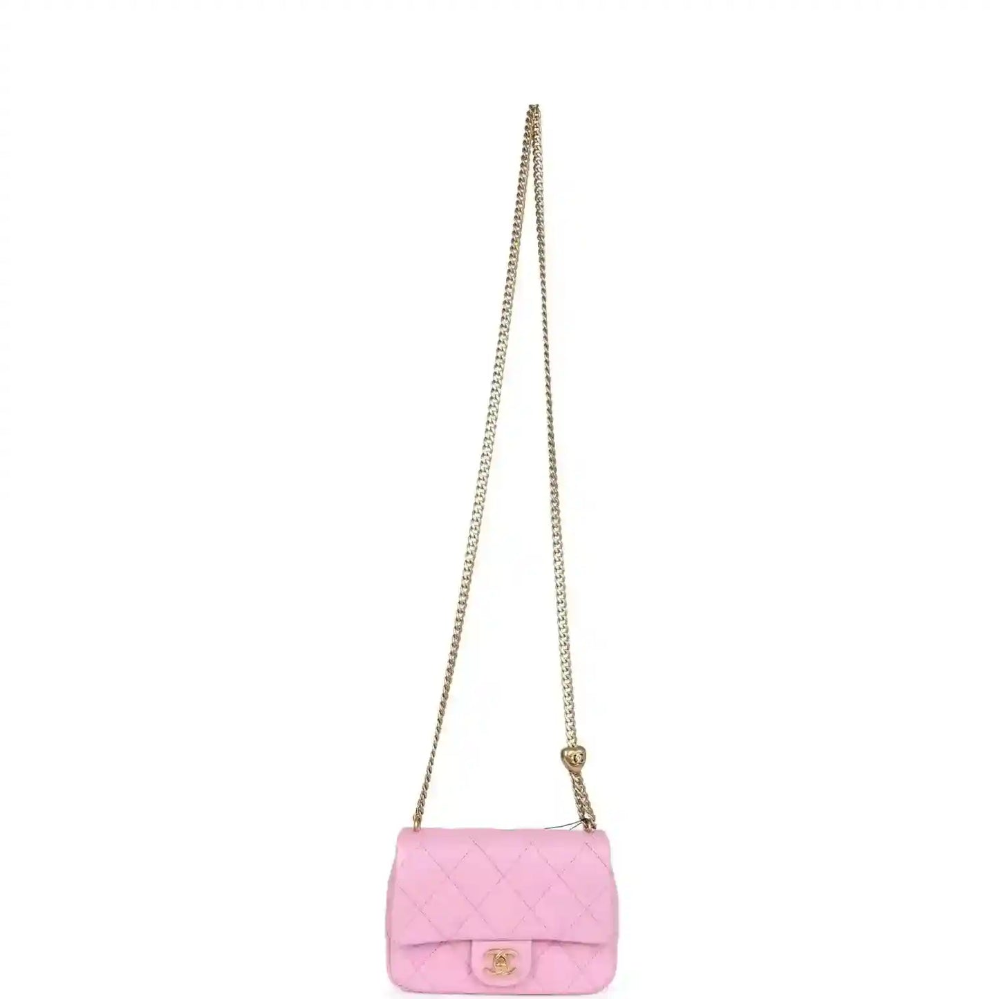 Pink mini flap bag with chain strap, small front flap, and CC logo turn-lock