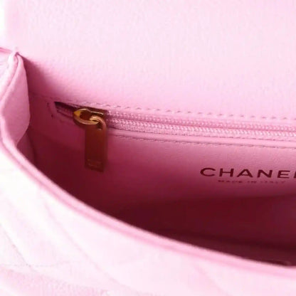 Pink leather mini square flap bag interior with zipper and gold hardware, CHANEL logo