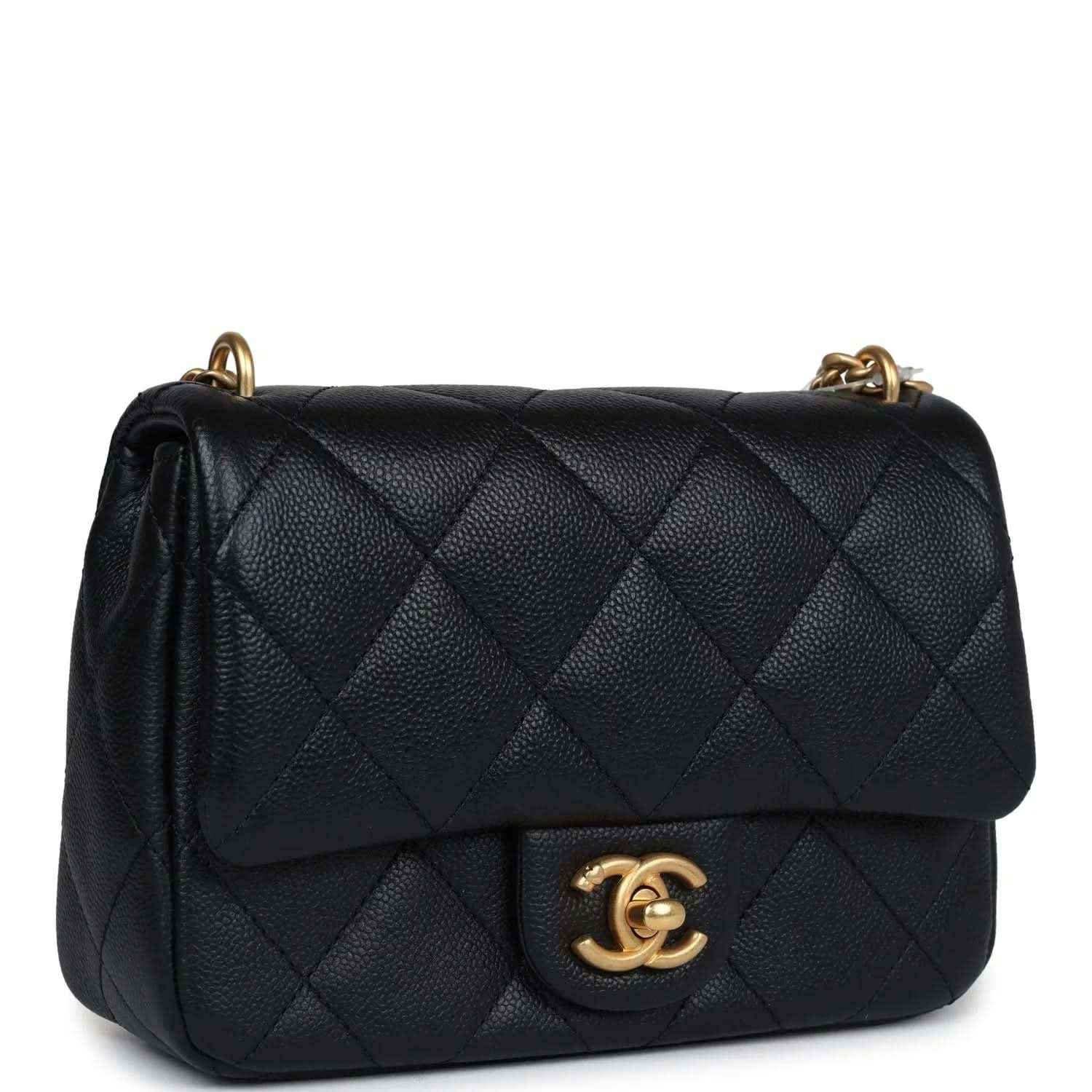 Mini quilted flap bag in black leather with gold CC emblem and chain strap.