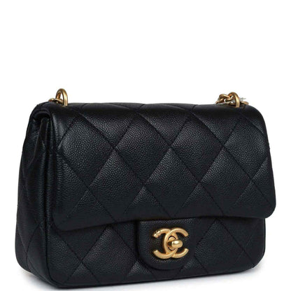 Mini quilted flap bag in black leather with gold CC emblem and chain strap.