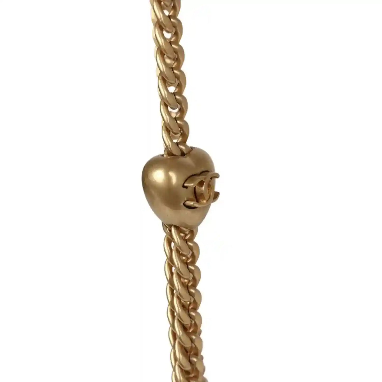 Gold-tone CC charm on linked chain strap for mini flap bag.