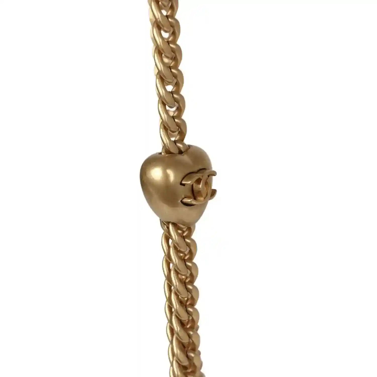 Gold-tone CC charm on linked chain strap for mini flap bag.