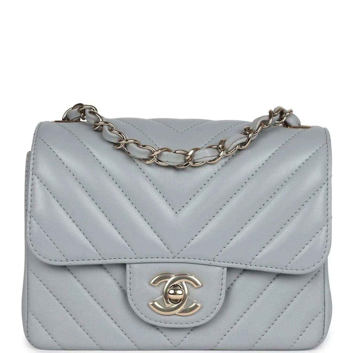 Light grey mini shoulder bag with chevron quilting, flap, and gold-tone CC clasp