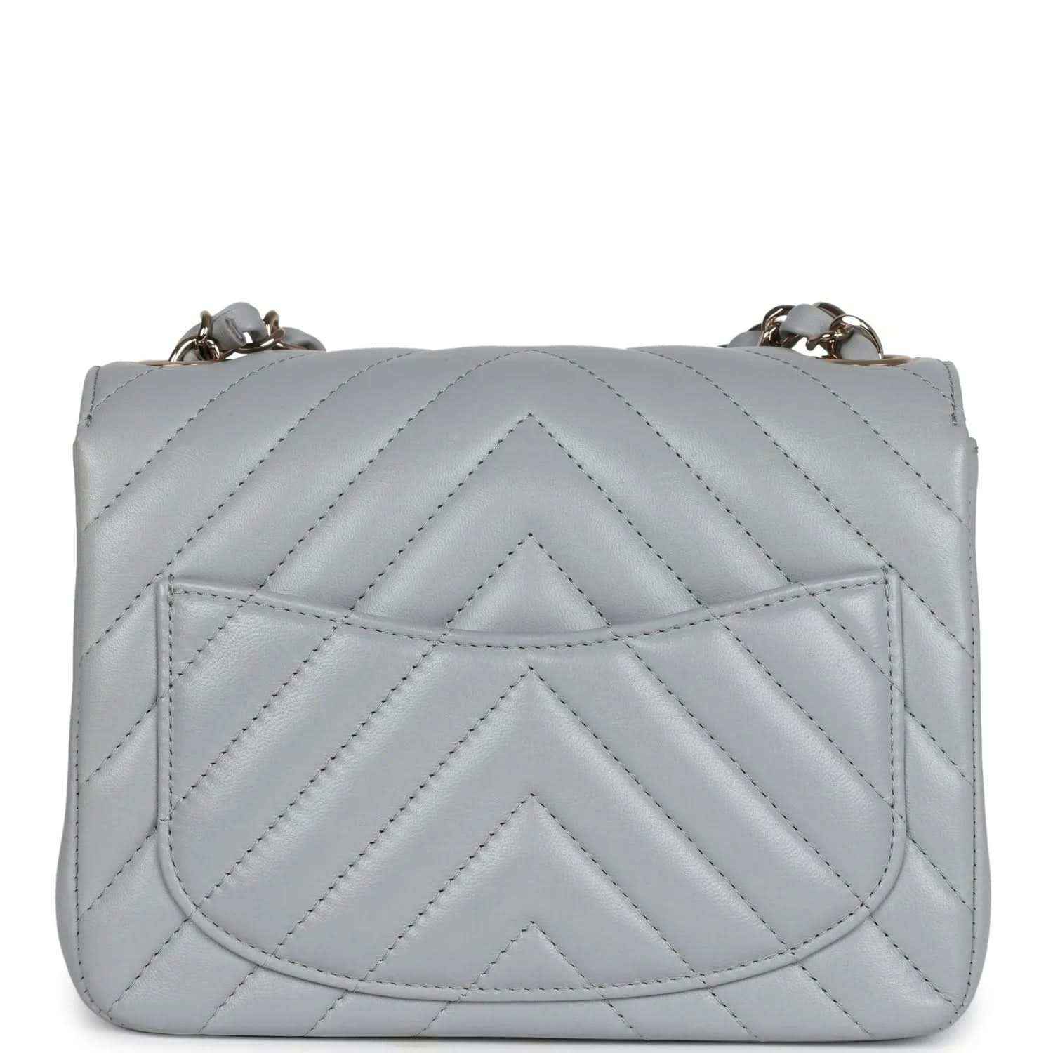 Light grey mini quilted bag with raised chevron quilting on the front