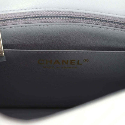 Dark grey lining with CHANEL logo on the mini bag interior