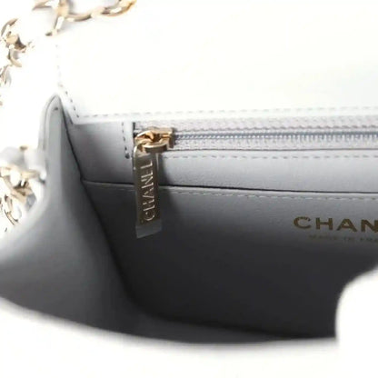 Light grey interior zipper pocket with CHANEL-branded zipper pull