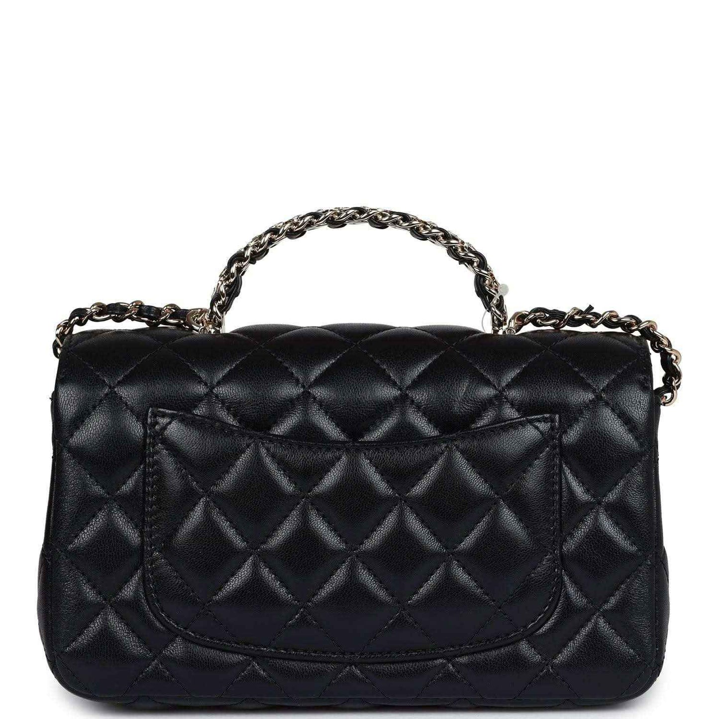 Mini rectangular flap bag in black quilted leather with top chain handle and curved flap
